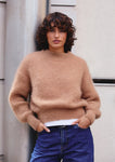 Naomi mesure 1m70 et porte une taille 2