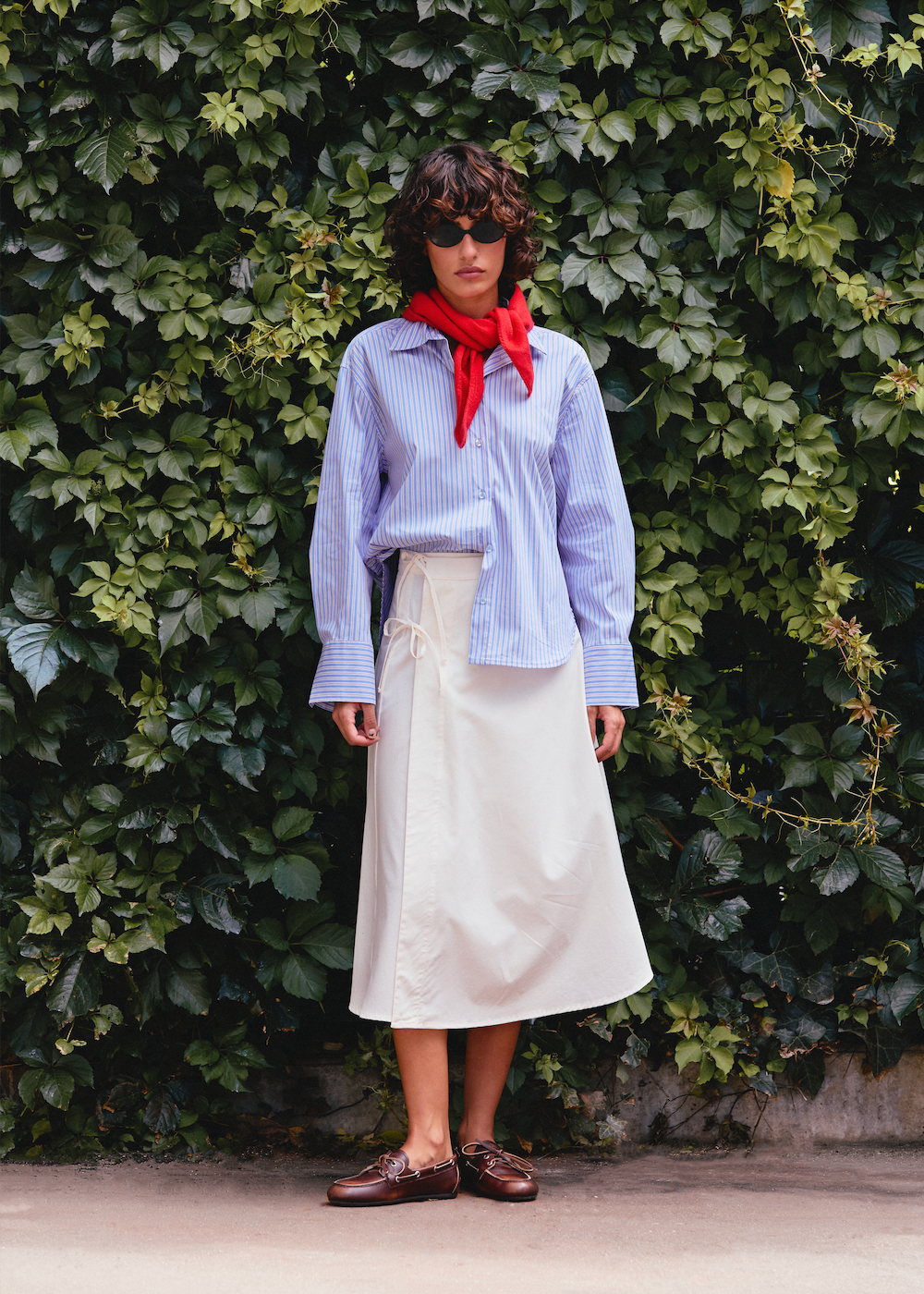 Naomi mesure 1m70 et porte une taille S/M