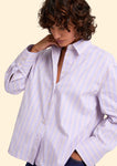 Naomi mesure 1m70 et porte une taille S.