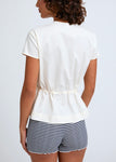 Naomi mesure 1m70 et porte une taille XS/S.