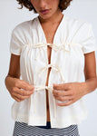 Naomi mesure 1m70 et porte une taille XS/S.