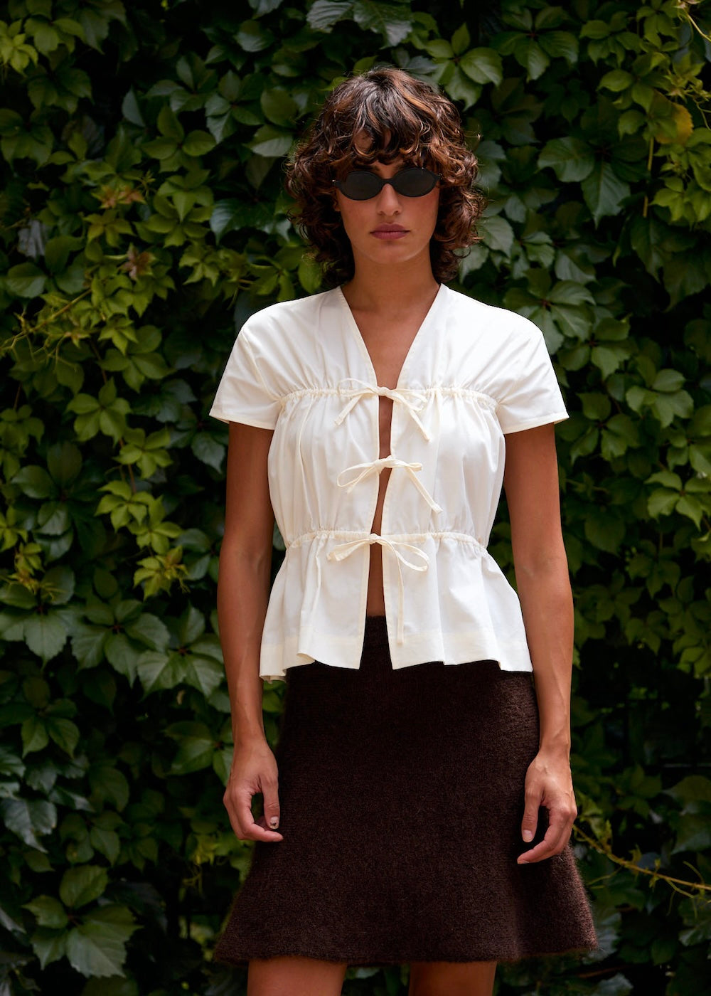 Naomi mesure 1m70 et porte une taille XS/S.