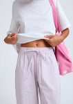Naomi mesure 1m70 et porte une taille XS/S.