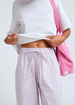 Naomi mesure 1m70 et porte une taille XS/S.