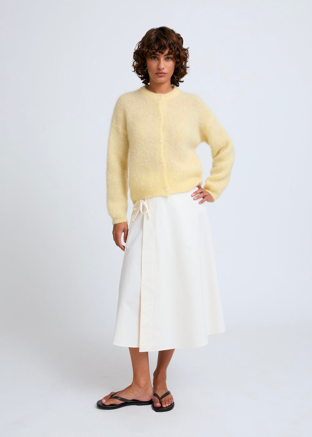 Naomi mesure 1m70 et porte une taille XS/S.