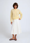 Naomi mesure 1m70 et porte une taille XS/S.