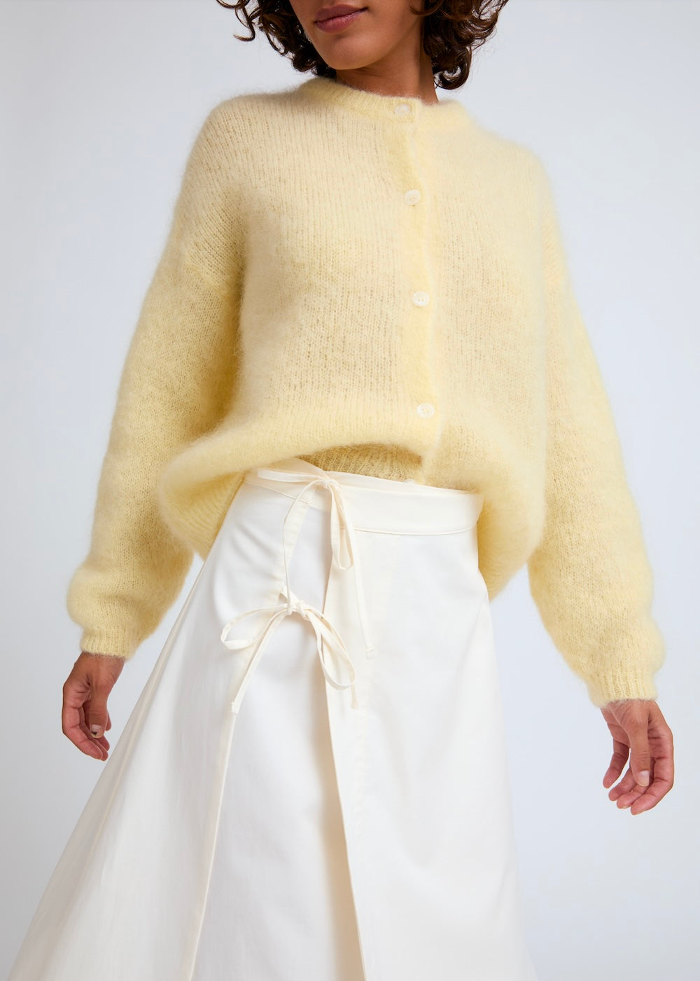 Naomi mesure 1m70 et porte une taille XS/S.