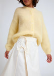Naomi mesure 1m70 et porte une taille XS/S.