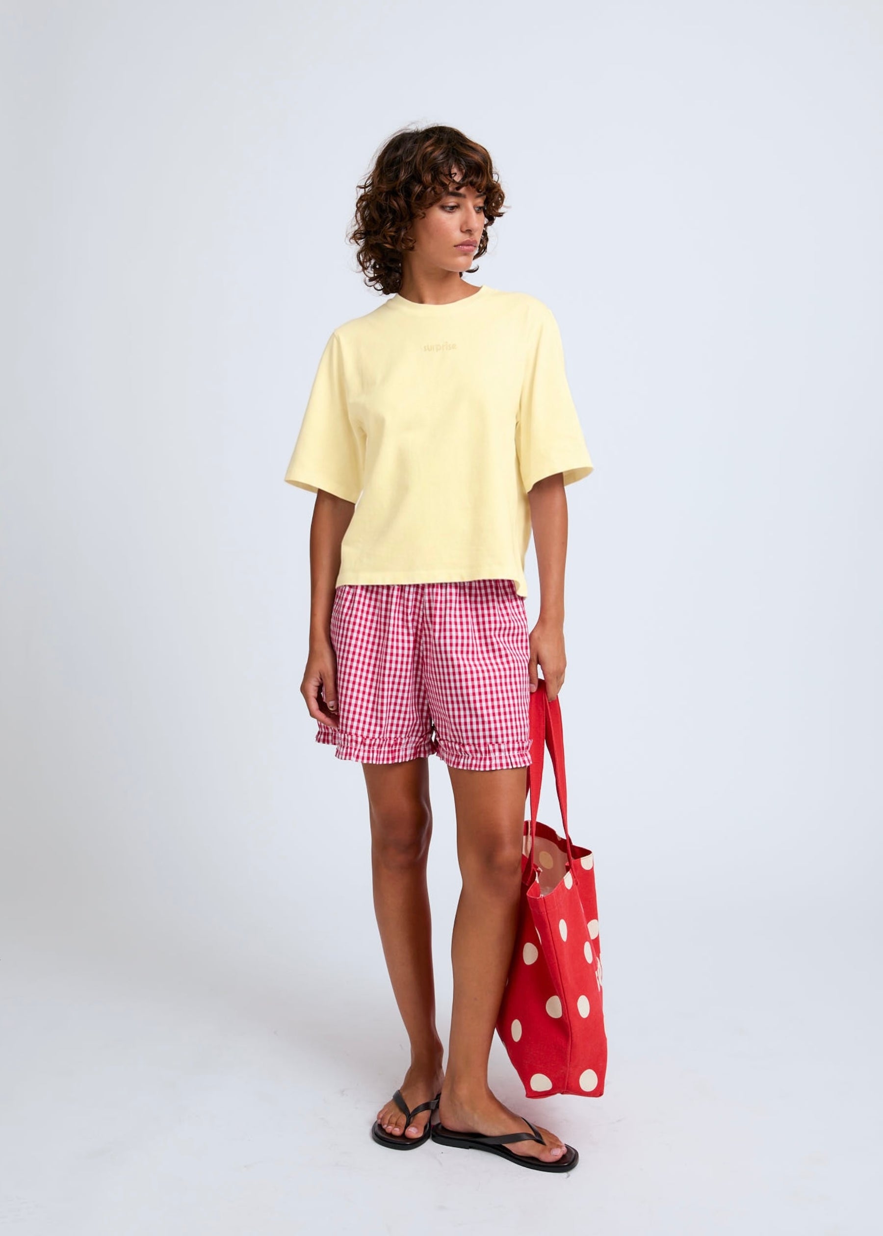 Naomi mesure 1m70 et porte une taille XS.