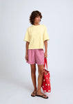 Naomi mesure 1m70 et porte une taille XS.